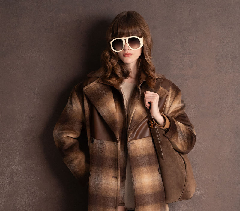 Model wearing sunglasses and a heavy brown shirt for Grey Ven