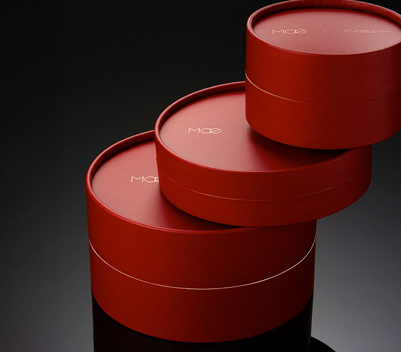 Stack of Mae Accessories product boxes